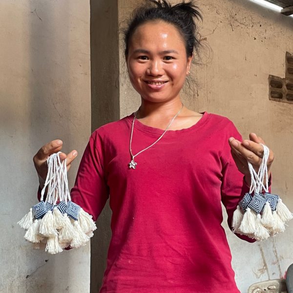 Lanten artisan holding handmade ornaments