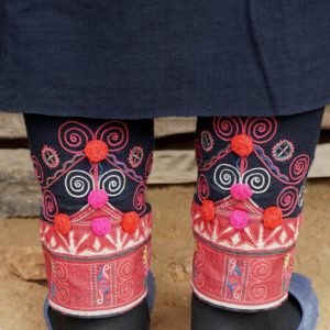 Oma motifs embroidered on leg wraps
