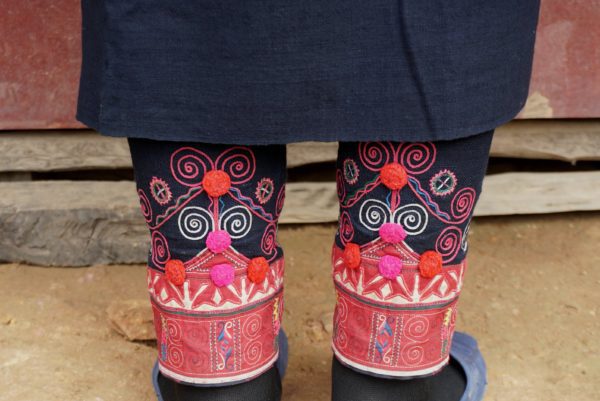 Oma motifs embroidered on leg wraps