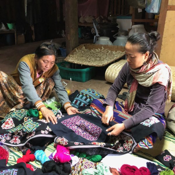 TAEC's co-founder working with Iu Mien artisan in Laos